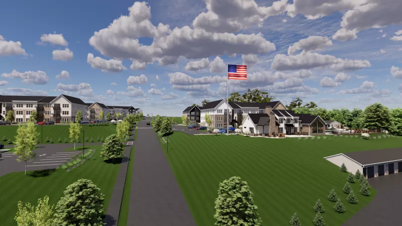 Rendering of a modern suburban apartment complex with multiple buildings, green lawns, roads, and a US flag flying.