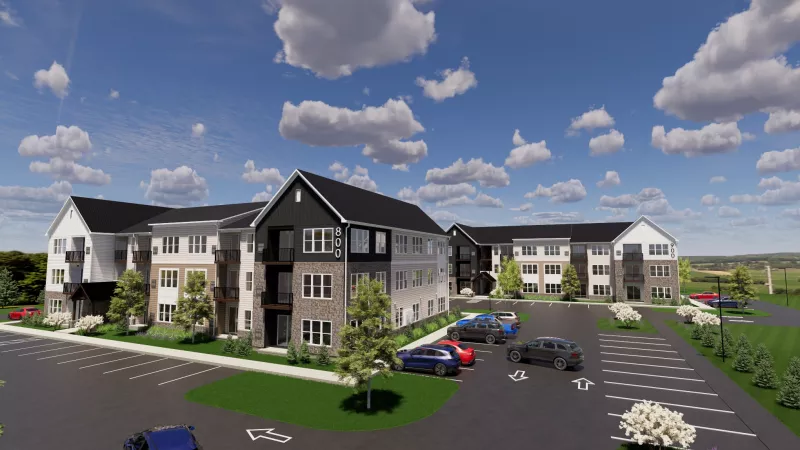 Rendering of a modern, multi-building apartment complex with parking lots and green landscaping under a cloudy sky.