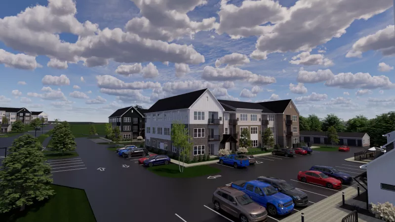 3D rendering of a modern apartment complex with multiple buildings, a parking lot full of cars, and a cloudy sky.