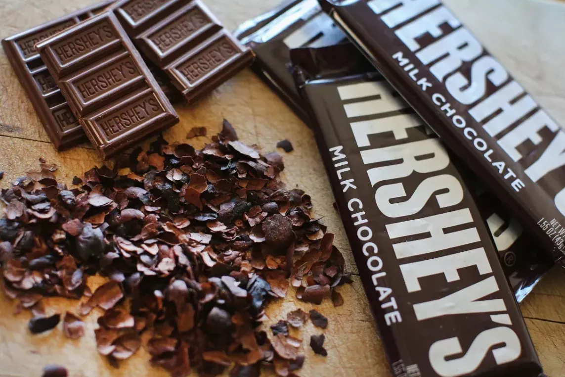 Hershey chocolate bars in wrapper, without wrapper, and chopped up.