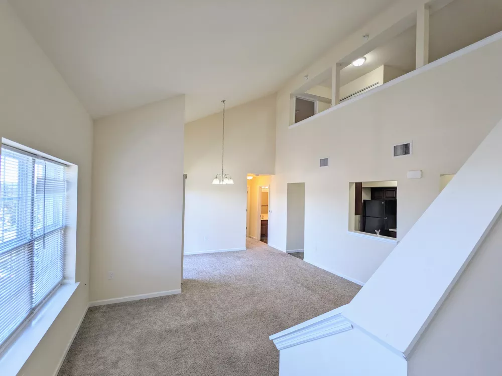 Open-concept upper level with lofted views, vaulted ceilings, and an overlook into the main living area.