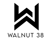 Black and white Walnut 38 logo featuring angular double-W monogram design with bold lines, representing a modern Lancaster apartment community.