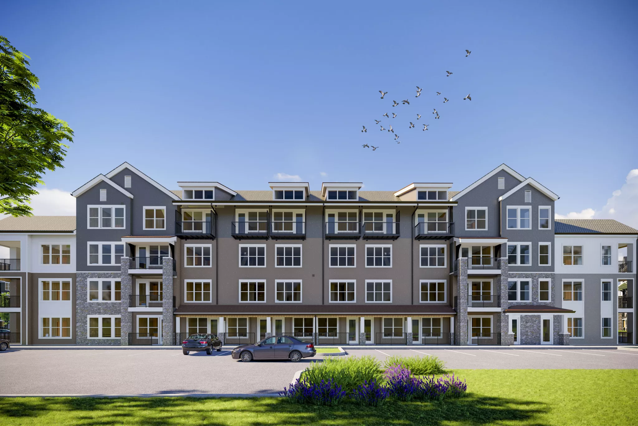 Front-facing elevation of apartment building at The Pointe at Overlook with multiple balconies and parked cars in foreground