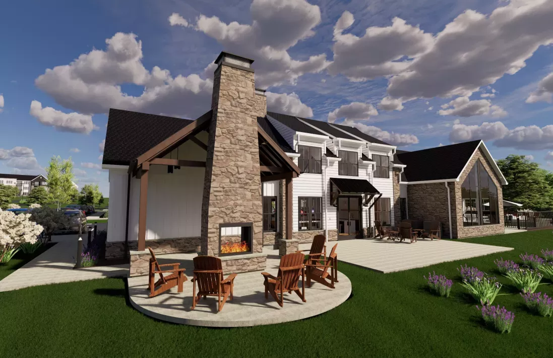 Rendering of a modern clubhouse back area with a stone outdoor fireplace, burning fire, Adirondack chairs, and patio.